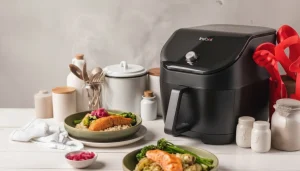 Air fryer cooking frozen salmon with vegetables 