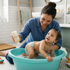 Mother giving her baby a wash