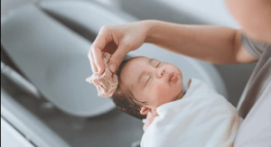 Mother washing her baby"s hair