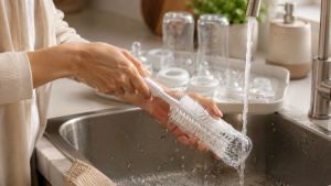 Washing bottle with cleaning brush