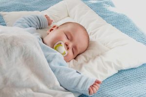 Should baby sleep with a pillow? Soft baby pillow shown for safe sleep educationSelect 86 more words to run Humanizer.